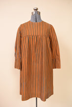 Load image into Gallery viewer, Late 1960s Orange Blue Green Stripe Silver Button Mini Dress By Marimekko, pictured from the front.

