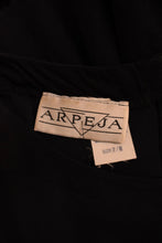 Load image into Gallery viewer, Black Cotton Ruffle Maxi Dress by Arpeja. Close up of the tag.
